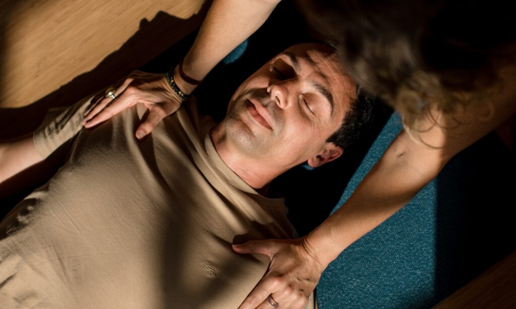 Student in savasana in a Yoga Nidra class