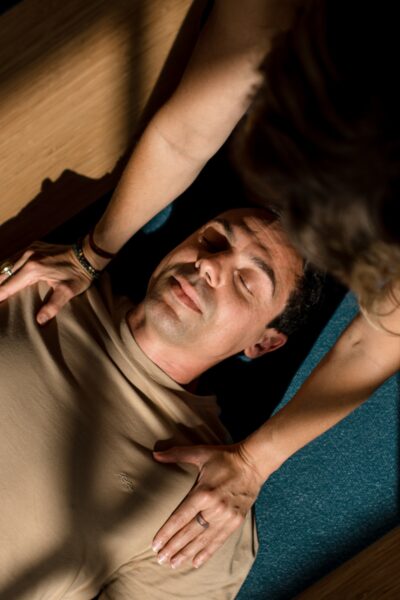 Student in savasana in a Yoga Nidra class