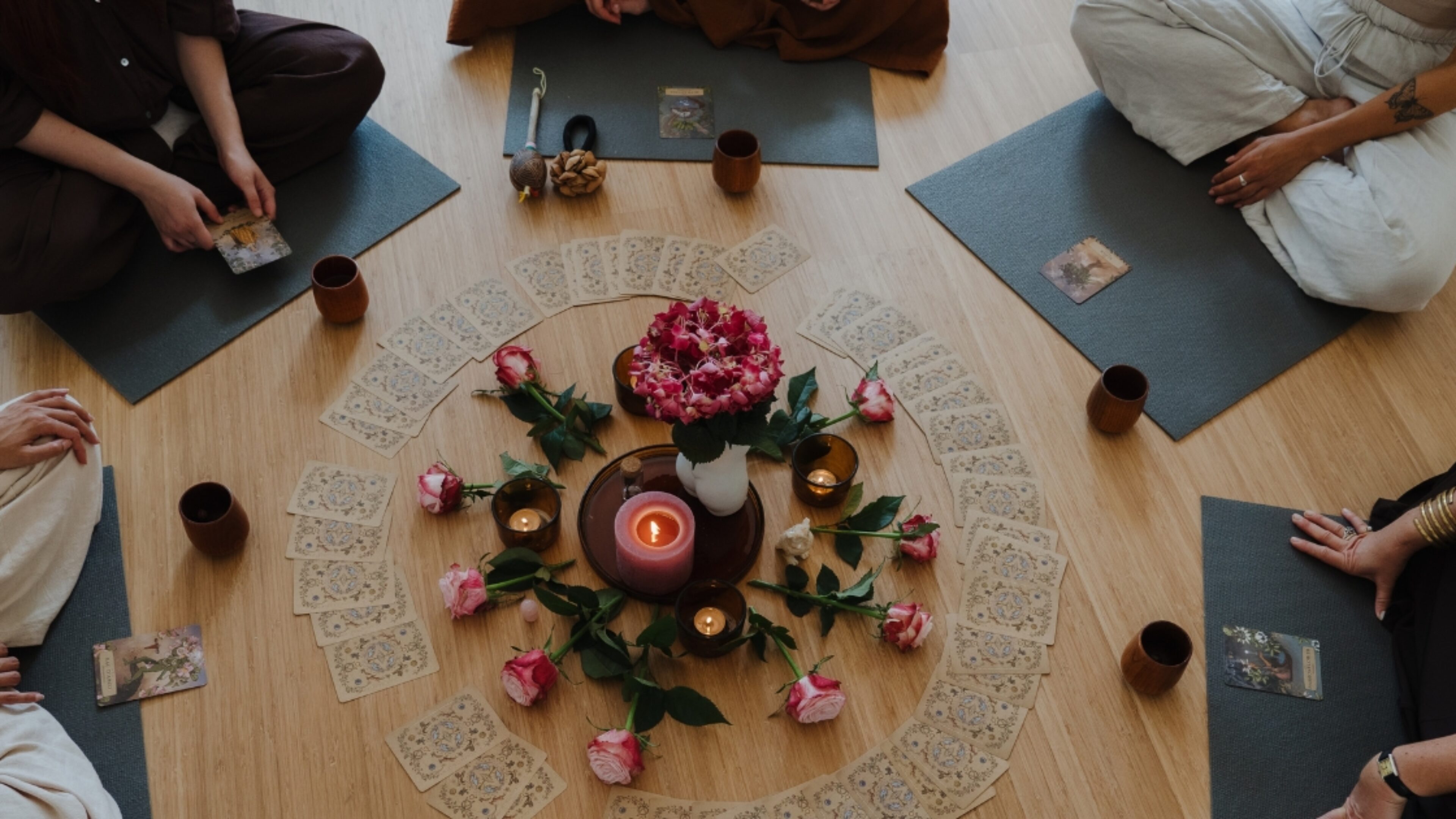 Group of women drinking cacao during a ceremony at De Nieuwe Yogaschool