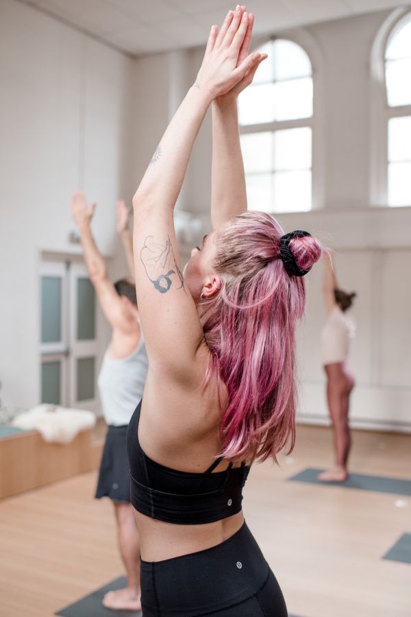 Student in a yoga pose during a Vinyasa class at De Nieuwe Yogaschool
