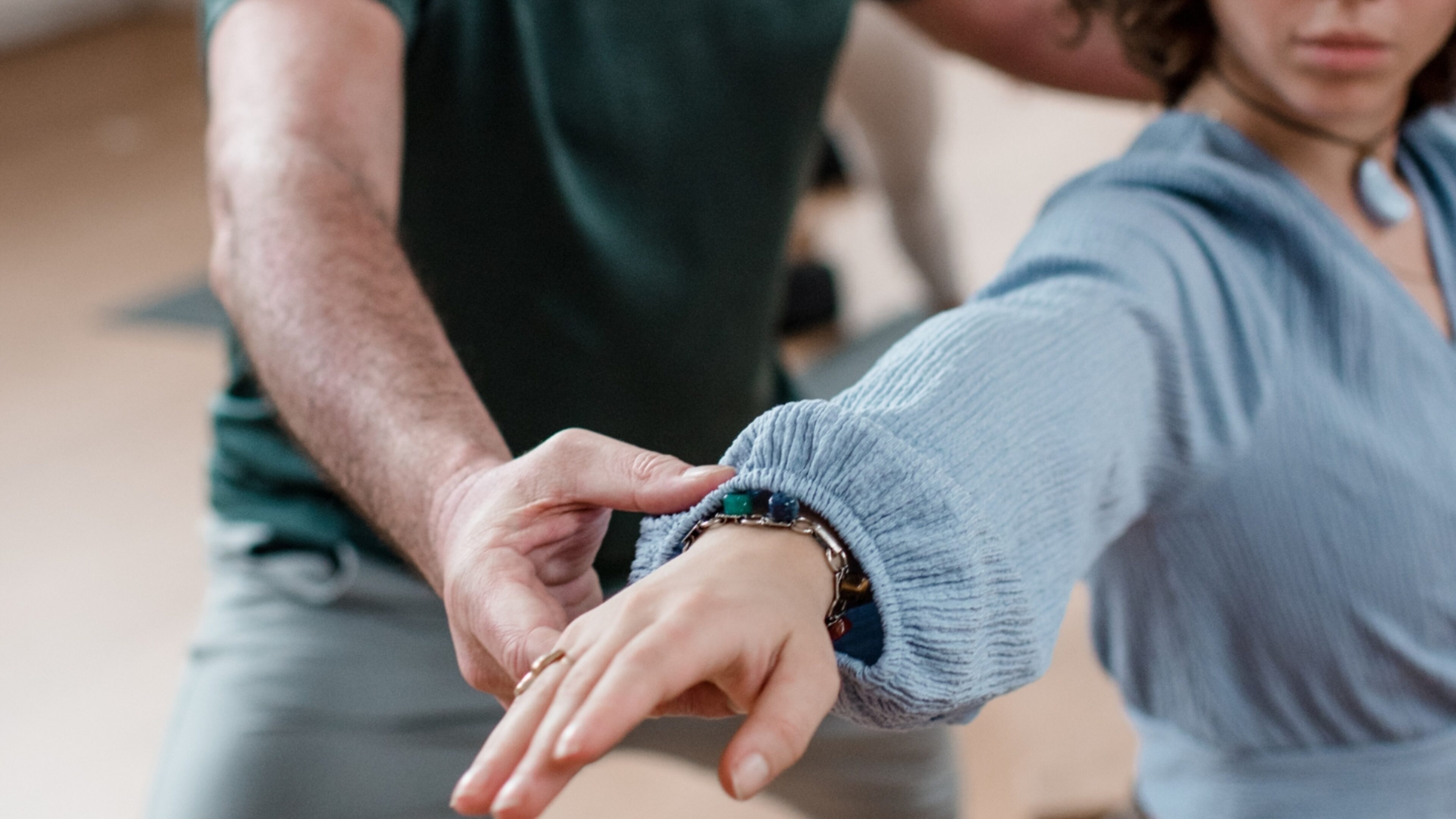 Student in a Vinyasa pose being adjusted by DNYS Academie teacher Johan Noorloos